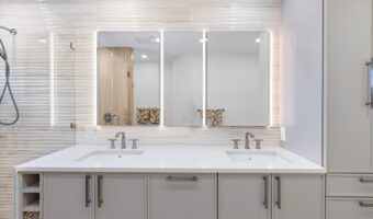 Modern bathroom vanity with dual sinks, large mirror, and sleek white cabinetry for stylish home ren.