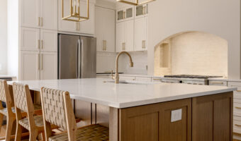 Modern kitchen with white cabinets, marble countertops, and gold accents, perfect for home renovatio.