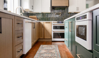Modern kitchen with mixed wood and painted cabinetry, under the theme "The Rooted Kitchen".