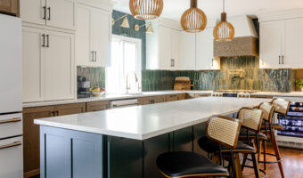 Bright modern kitchen with white cabinets, green backsplash, and stylish pendant lighting, perfect f.