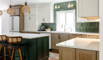 Modern kitchen with green tile backsplash and white cabinetry, part of The Rooted Kitchen renovation.
